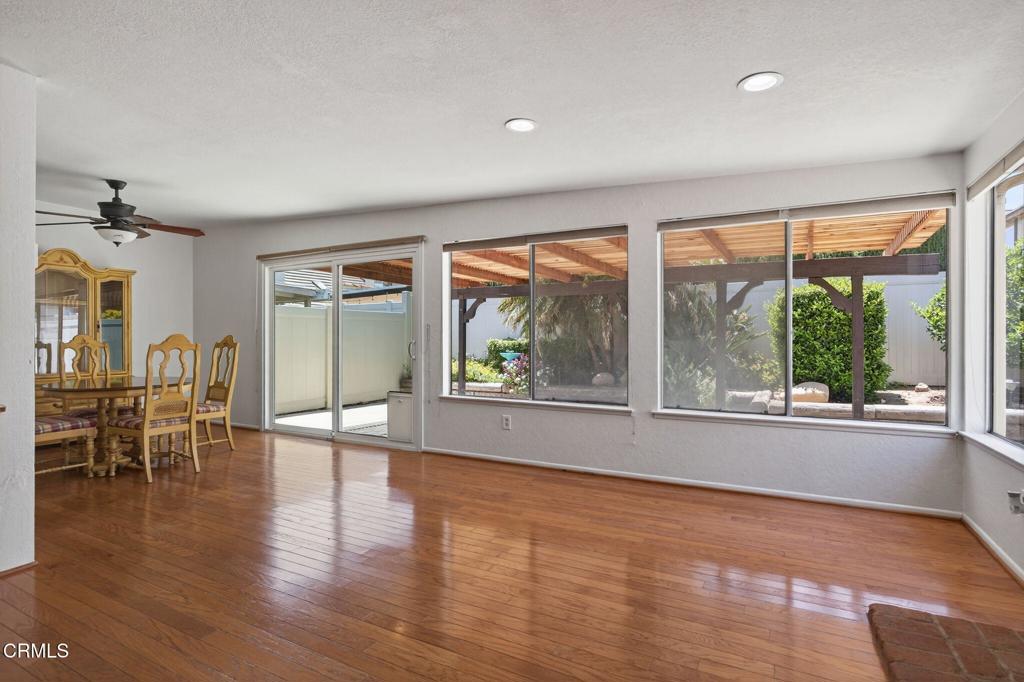 27127 Rio Bosque Drive Valencia, CA 91354 - Photo 6 of 11 an empty room with wooden floor and windows