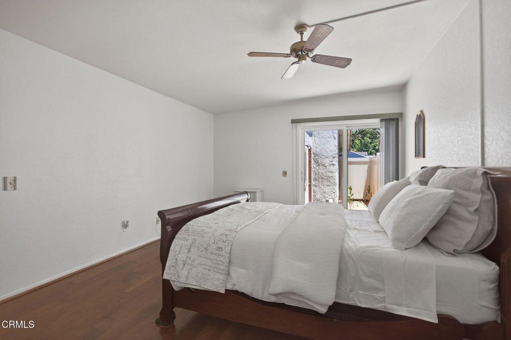 27127 Rio Bosque Drive Valencia, CA 91354 - Photo 7 of 11 a bedroom with a large bed window and a ceiling fan