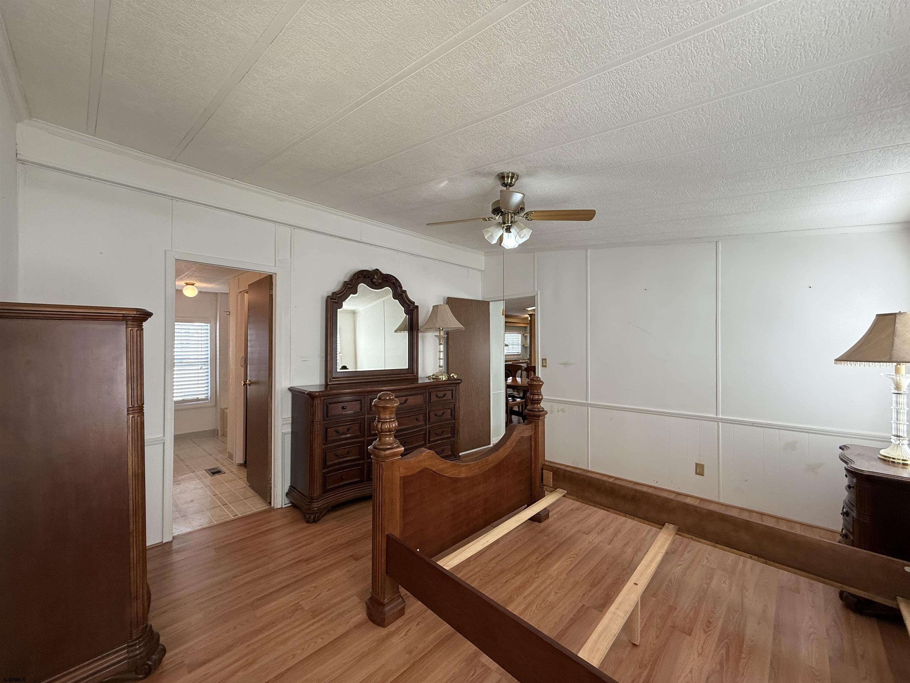 386 Indian Way Buena, NJ 08310 - Photo 15 of 37 a view of a bedroom with wooden floor and furniture