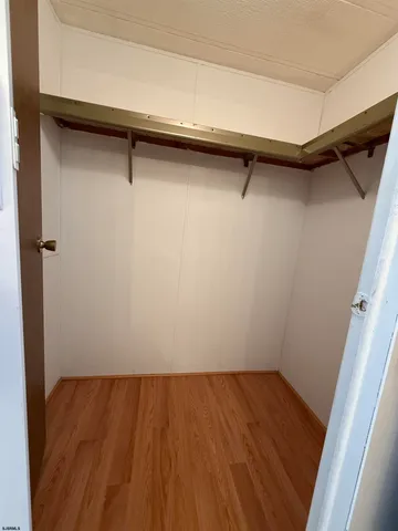 a view of a room with wooden floor and small space