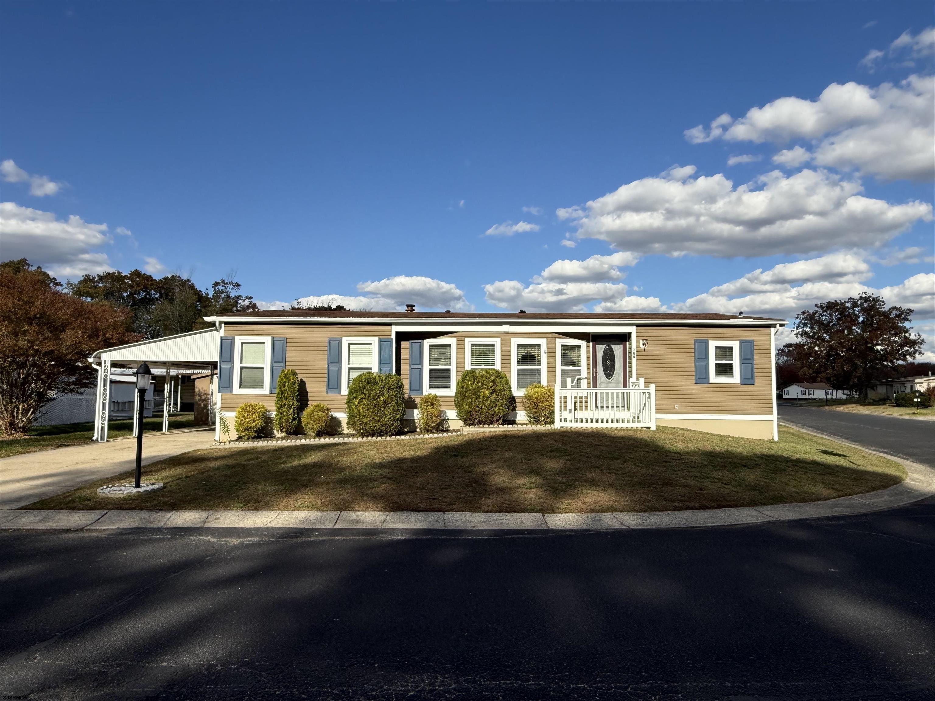 386 Indian Way Buena, NJ 08310 - Photo 2 of 37 a front view of a house with a yard