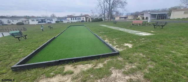 a view of a field with a big yard