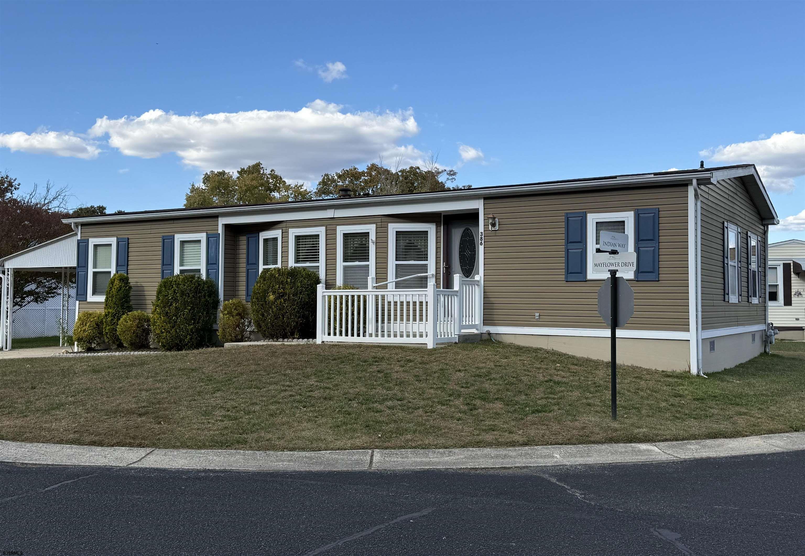 386 Indian Way Buena, NJ 08310 - Photo 3 of 37 a front view of a house with garden