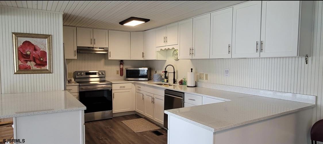 386 Indian Way Buena, NJ 08310 - Photo 34 of 37 a kitchen with cabinets appliances and a counter space