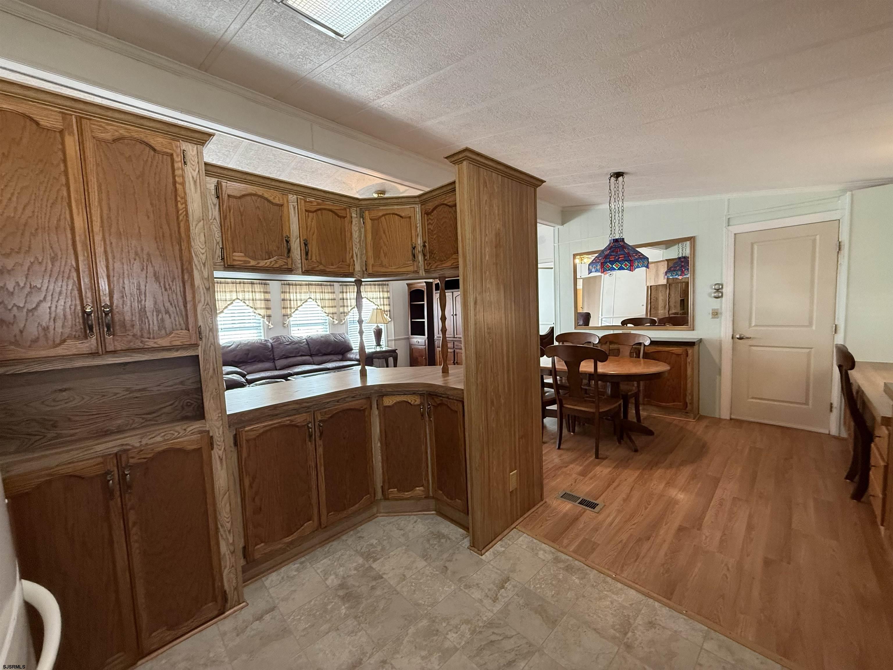 386 Indian Way Buena, NJ 08310 - Photo 8 of 37 a kitchen with stainless steel appliances granite countertop a refrigerator and a sink