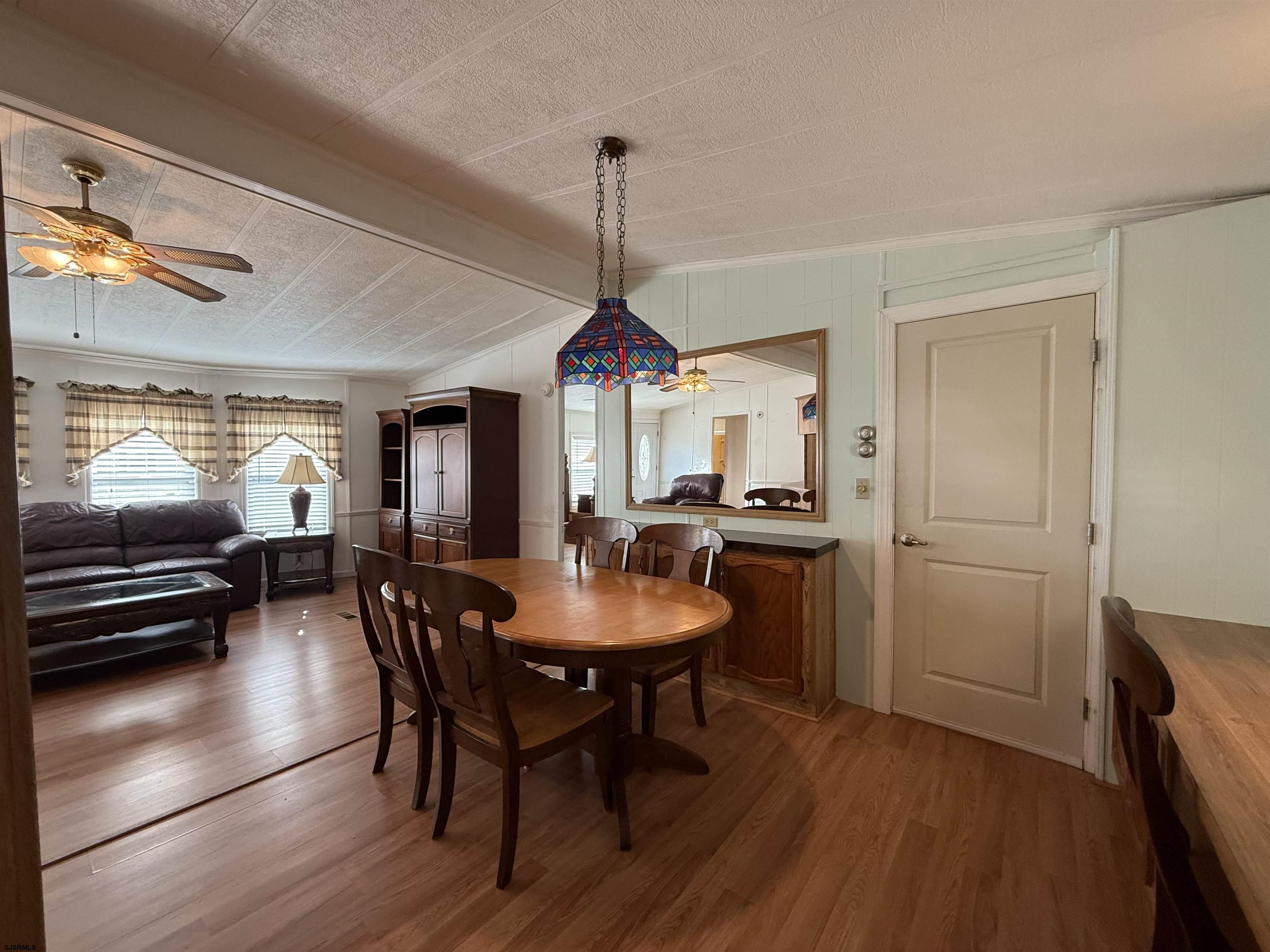 386 Indian Way Buena, NJ 08310 - Photo 10 of 37 a dining room with furniture window and wooden floor