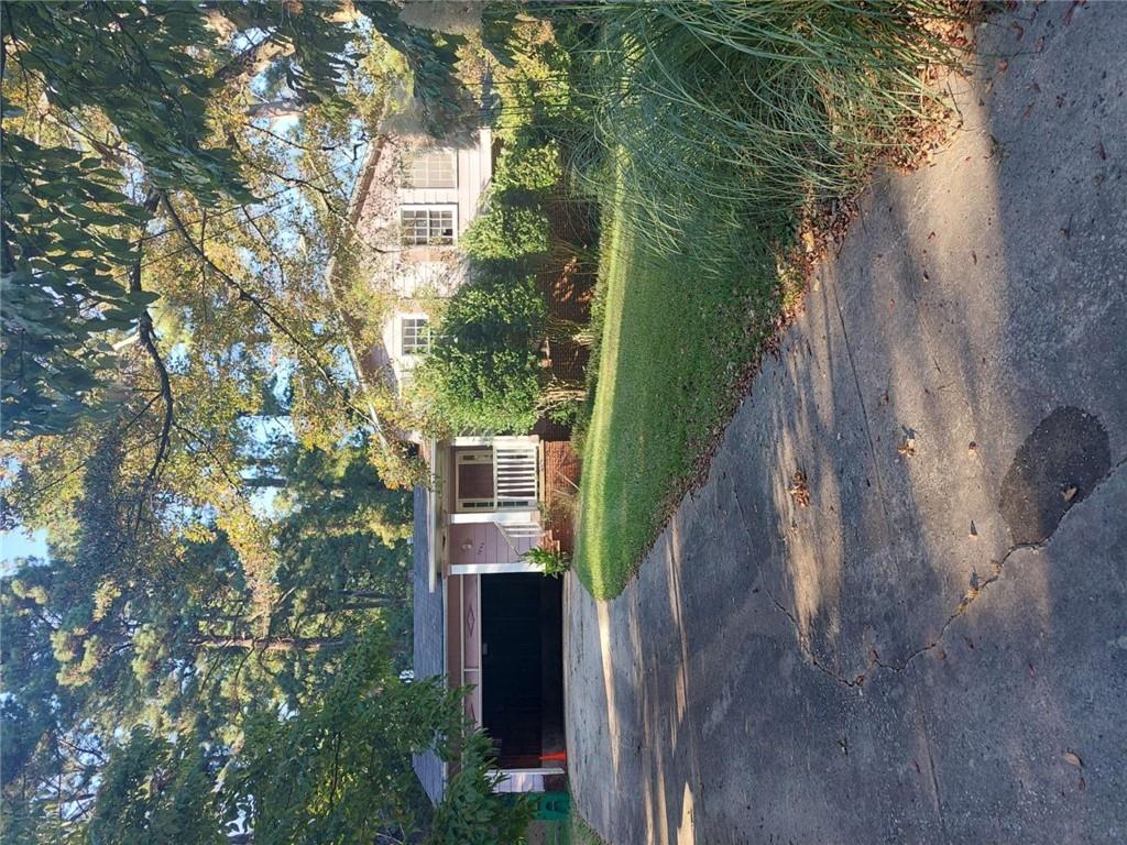 3664 Broadview Court Decatur, GA 30032 - Photo 1 of 3 a front view of a house with yard and green space