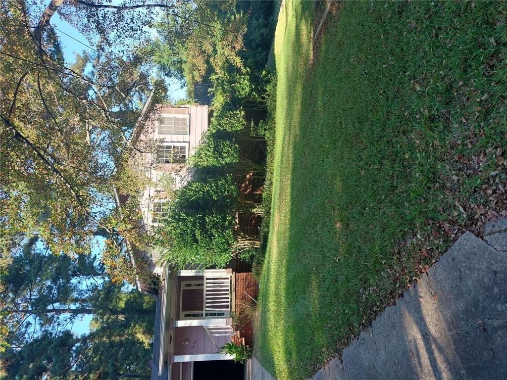 3664 Broadview Court Decatur, GA 30032 - Photo 3 of 3 a view of a house next to a big yard and large trees