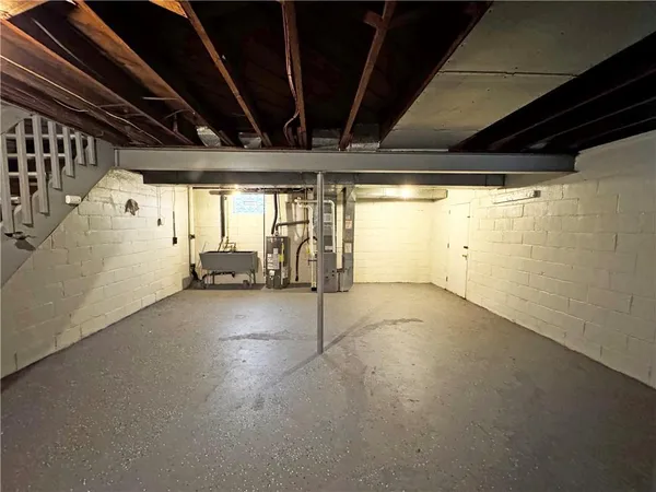 a view of empty room with wooden ceiling