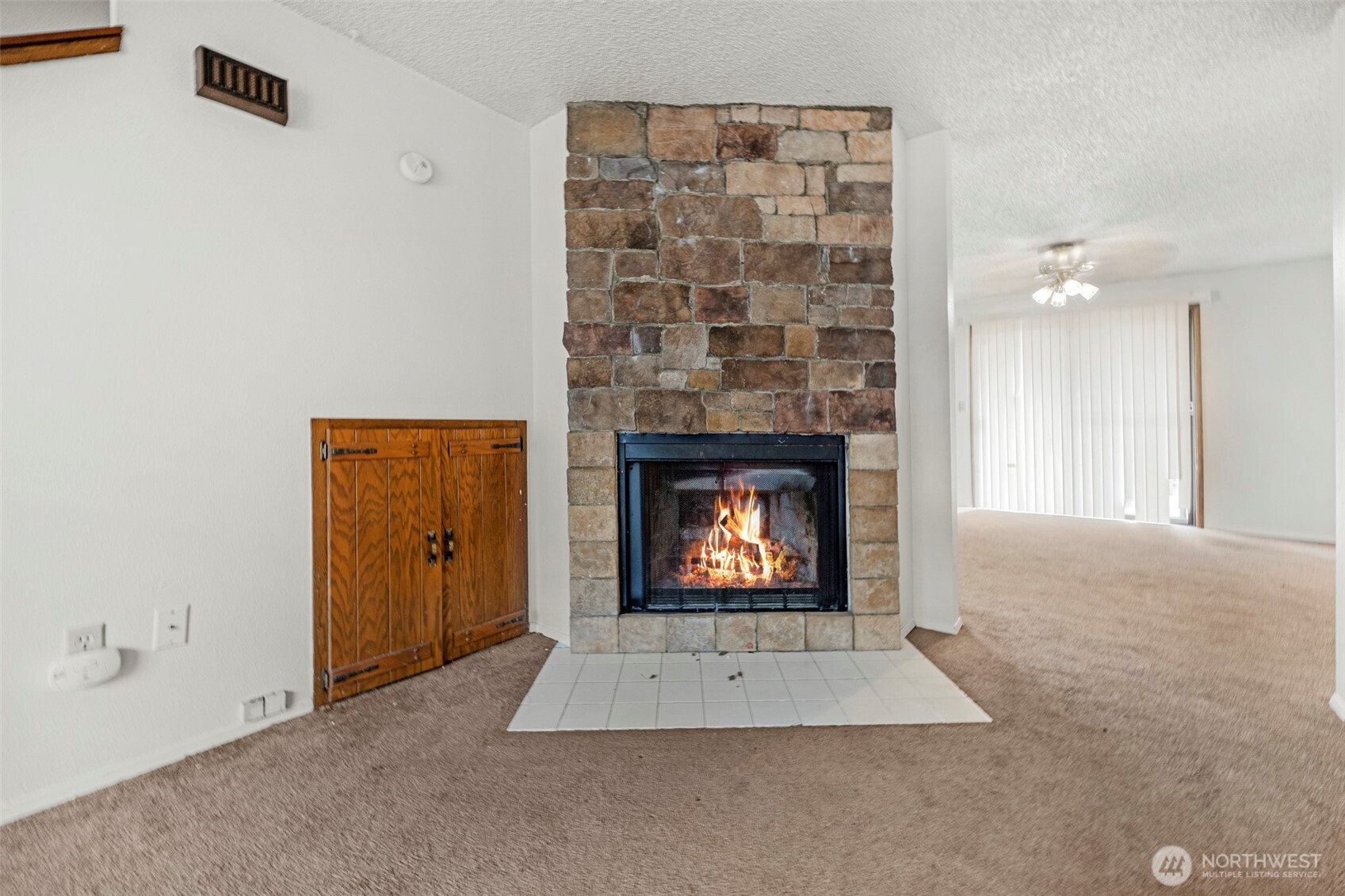 6920 Armar Road Marysville, WA 98270 - Photo 6 of 24 a view of an empty room with a fireplace