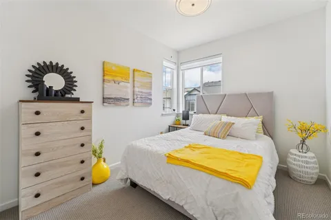 a bed room with a bed and a window