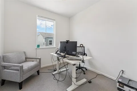 a work room with furniture and windows