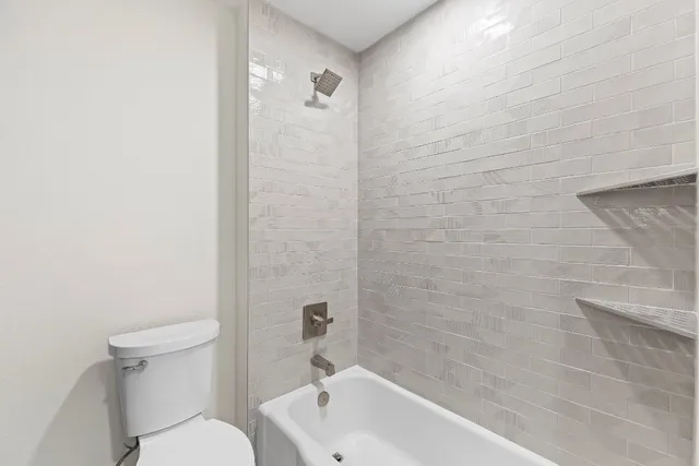 a bathroom with a toilet and sink