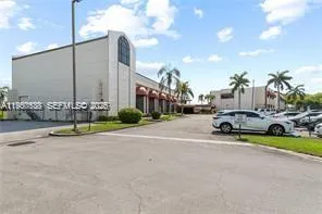 a view of a lake with houses in the background