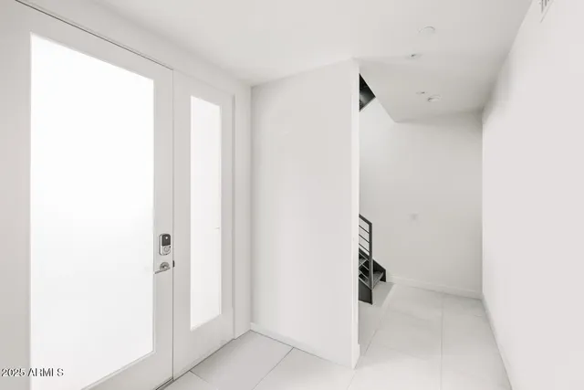 a bathroom with a double vanity sink mirror and double