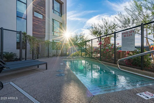 a view of a house with backyard porch and sitting area