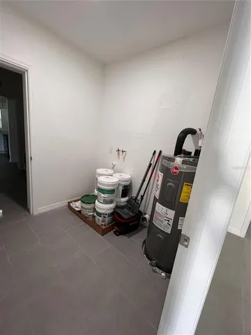 a bedroom with a bed and a ceiling fan