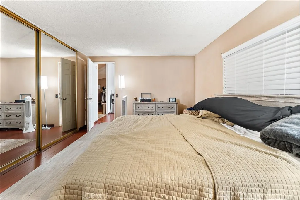 1051 Site, Unit 251 Brea, CA 92821 - Photo 13 of 23 a bedroom with a large bed and large mirror