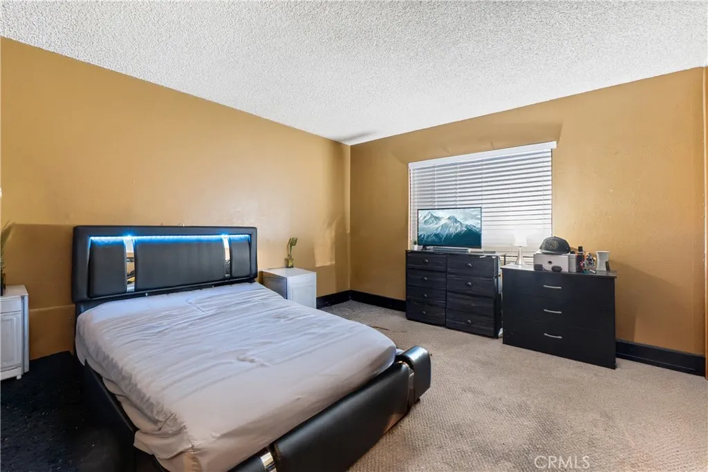 1051 Site, Unit 251 Brea, CA 92821 - Photo 15 of 23 a bedroom with a bed and a dresser