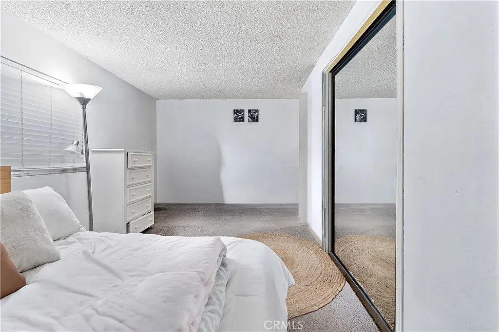 1051 Site, Unit 251 Brea, CA 92821 - Photo 17 of 23 a bedroom with a bed and cabinets