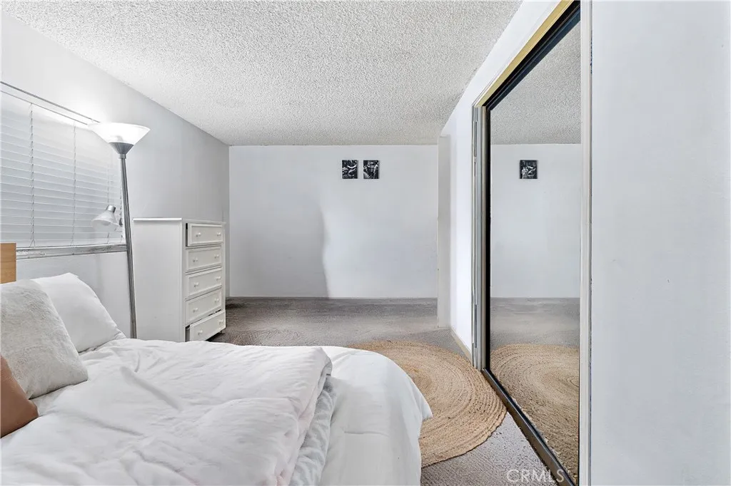 1051 Site, Unit 251 Brea, CA 92821 - Photo 17 of 23 a bedroom with a bed and cabinets