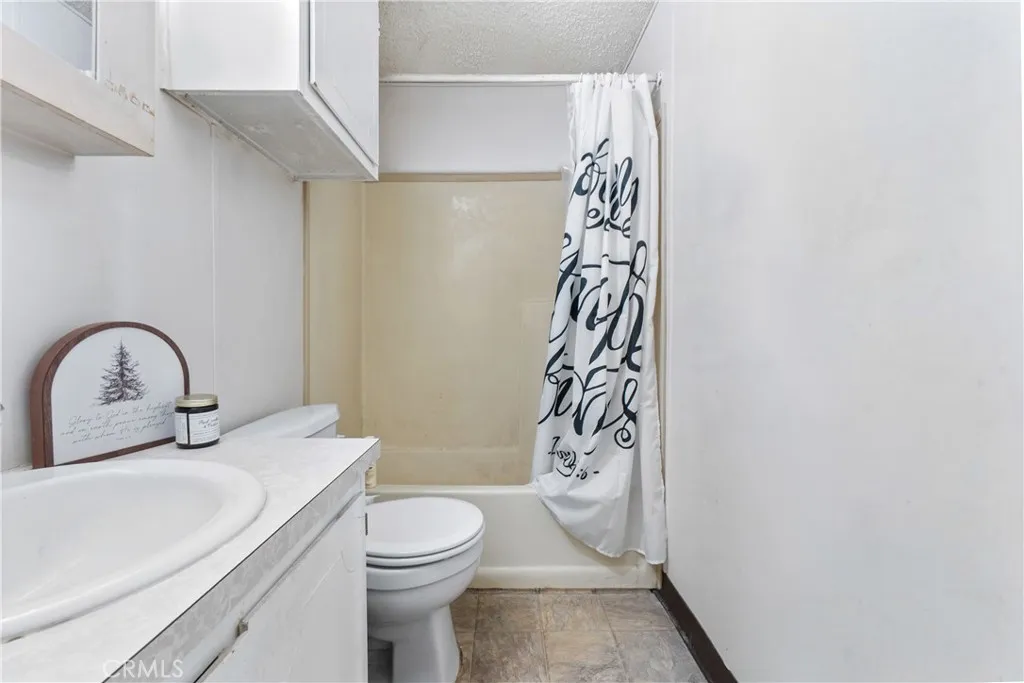 1051 Site, Unit 251 Brea, CA 92821 - Photo 18 of 23 a bathroom with a toilet sink and shower
