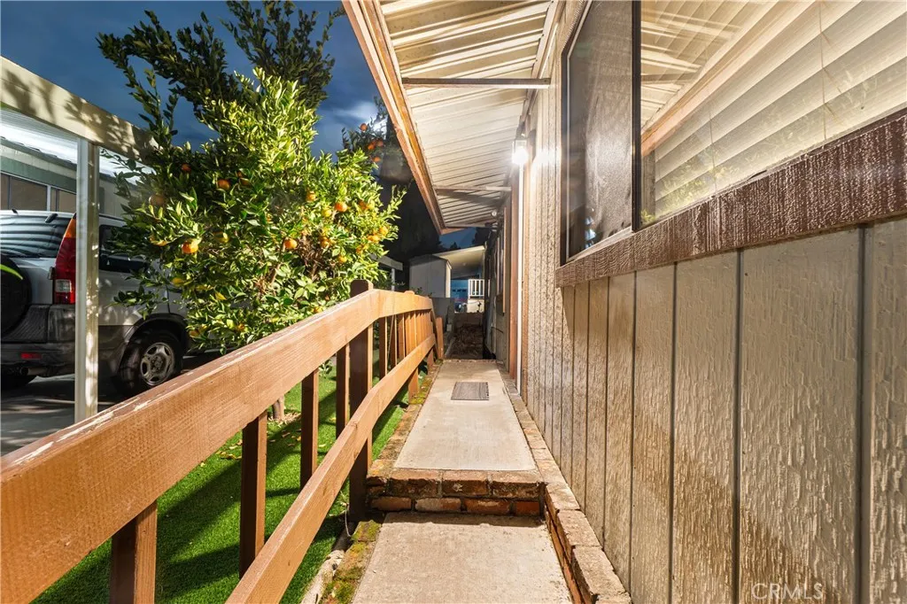 1051 Site, Unit 251 Brea, CA 92821 - Photo 21 of 23 a view of balcony with wooden floor and fence