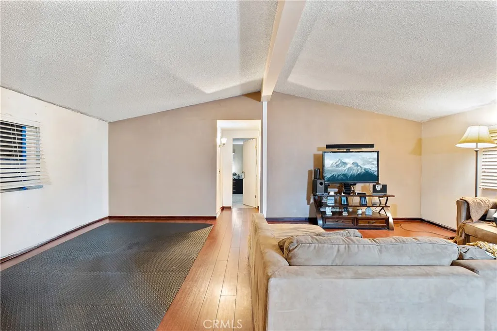 1051 Site, Unit 251 Brea, CA 92821 - Photo 3 of 23 a living room with furniture and a flat screen tv
