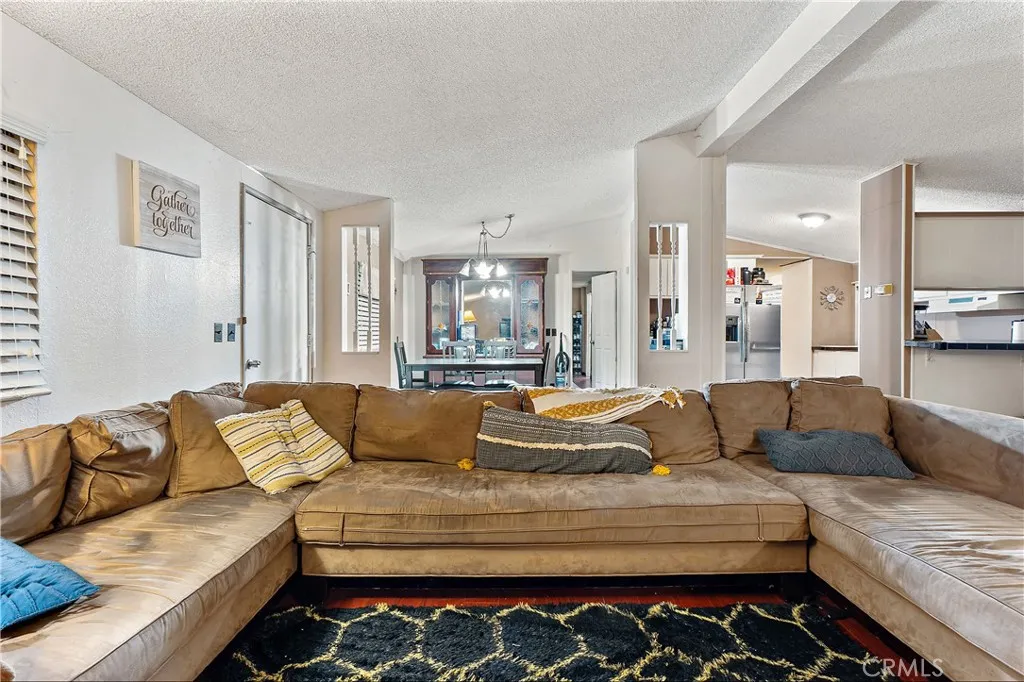 1051 Site, Unit 251 Brea, CA 92821 - Photo 6 of 23 a living room with furniture and a couch