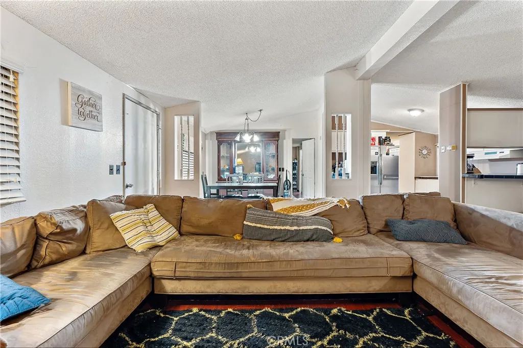 1051 Site, Unit 251 Brea, CA 92821 - Photo 6 of 23 a living room with furniture and a couch