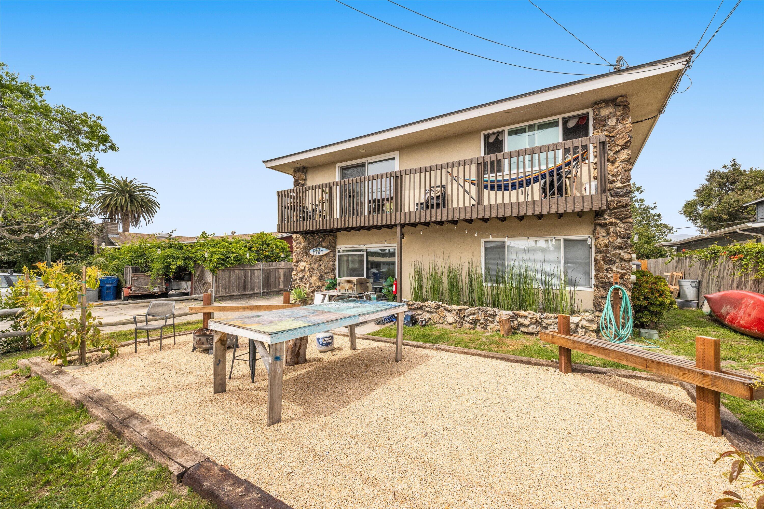 a view of a patio with swimming pool table and chairs