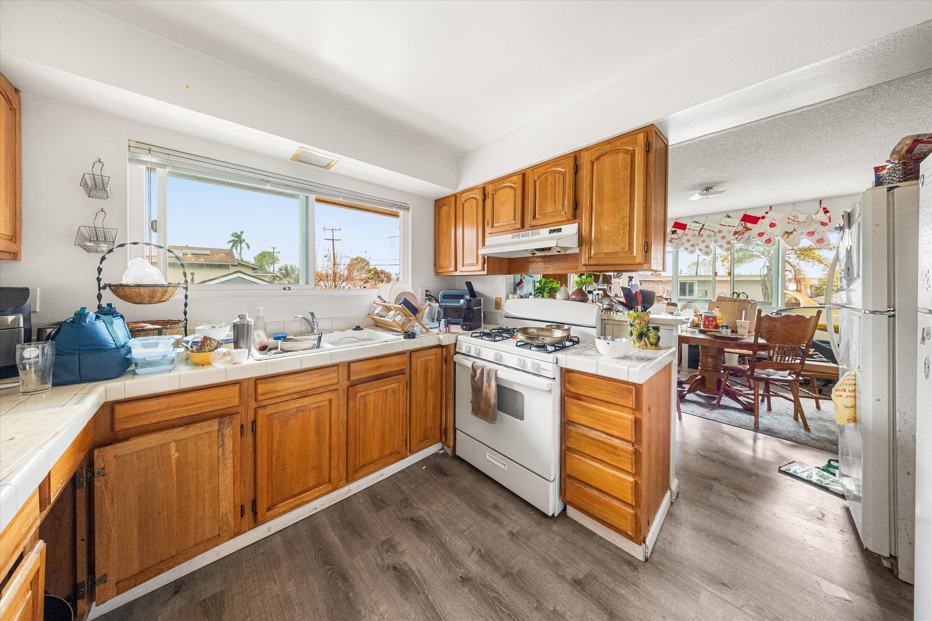 6724 Pasado Road Goleta, CA 93117 - Photo 15 of 24 a kitchen with a sink cabinets and window