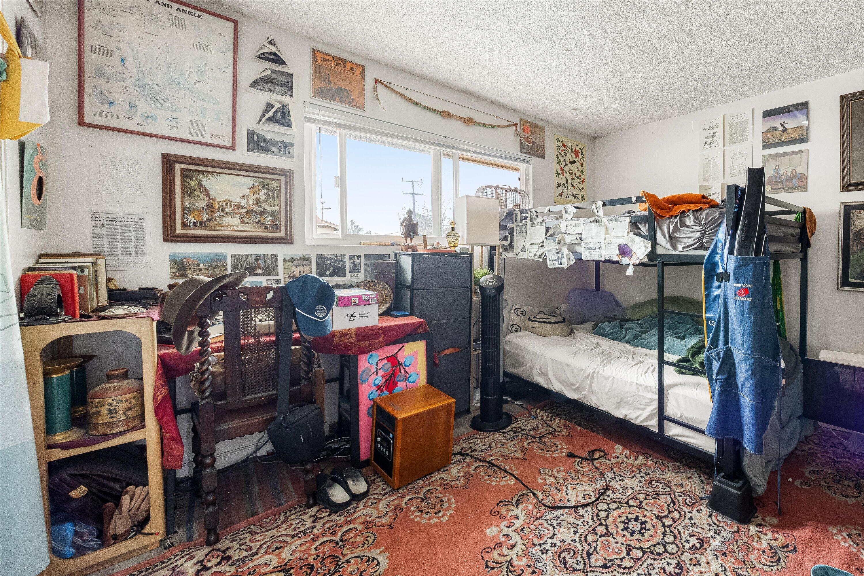 6724 Pasado Road Goleta, CA 93117 - Photo 16 of 24 a bed room with a bed and a chair
