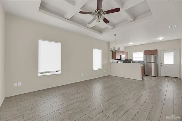 a view of a kitchen with a sink cabinets and wooden floor
