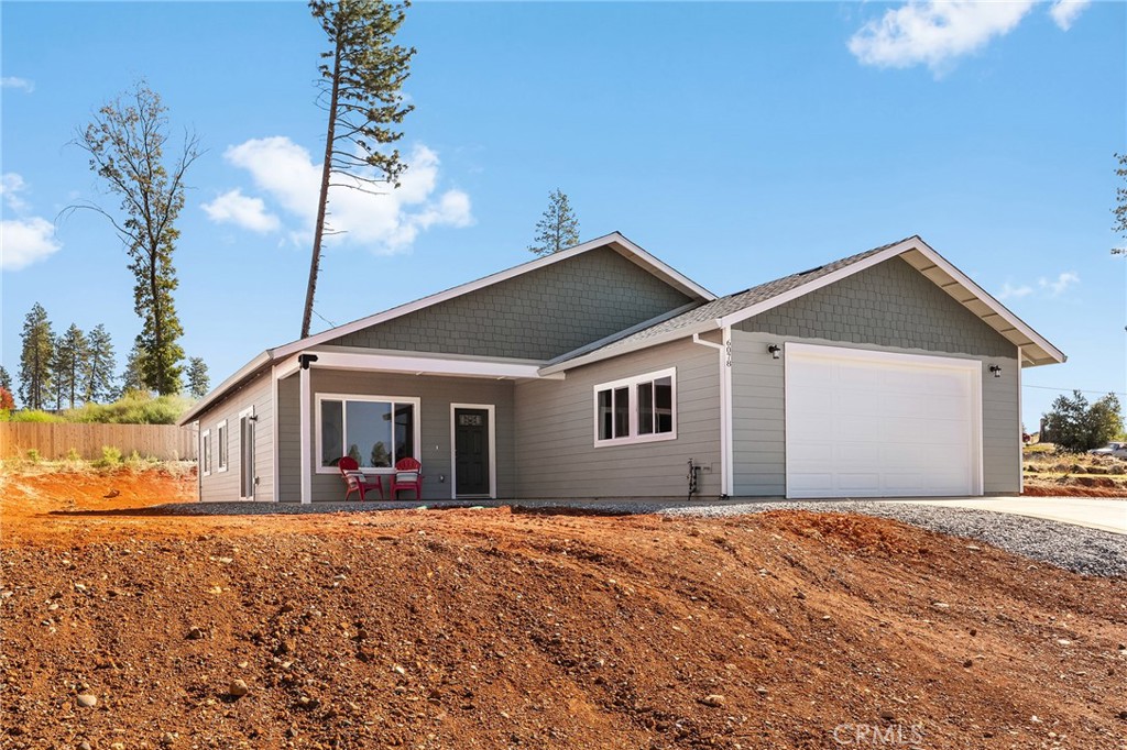 6078 Maxwell Drive Paradise, CA 95969 - Photo 1 of 44 a front view of house with yard and trees around