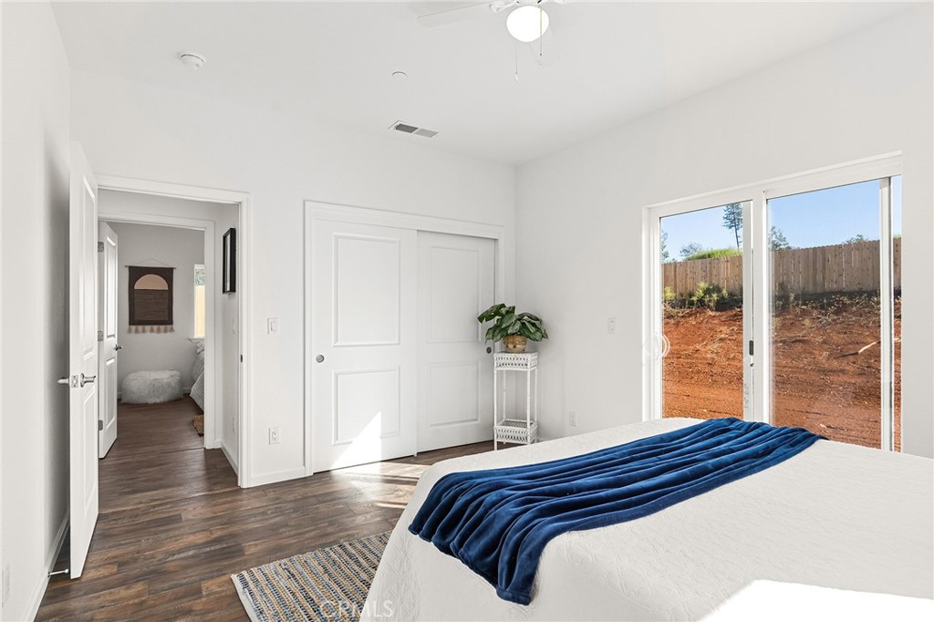 6078 Maxwell Drive Paradise, CA 95969 - Photo 23 of 44 a bedroom with a bed and a large window