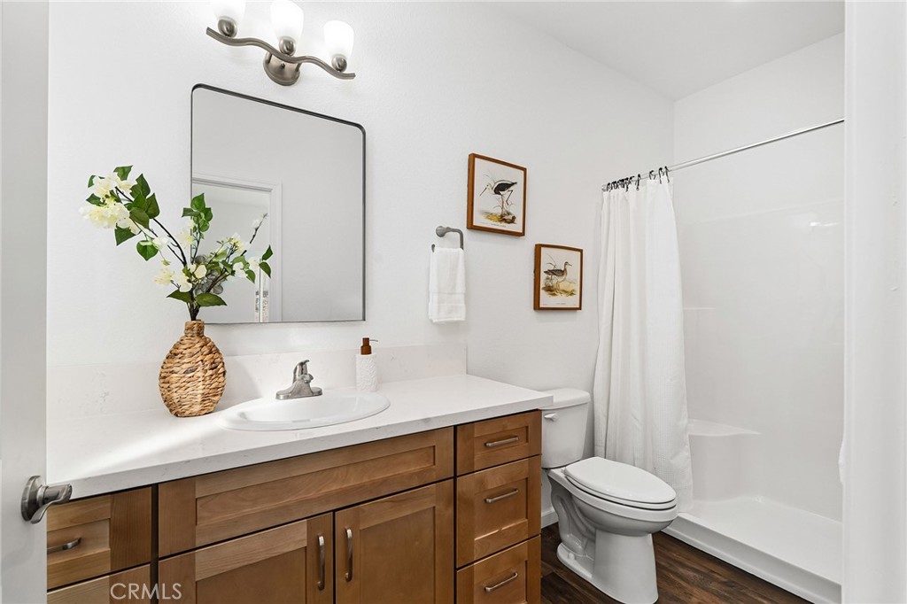 6078 Maxwell Drive Paradise, CA 95969 - Photo 25 of 44 a bathroom with a sink a toilet and mirror