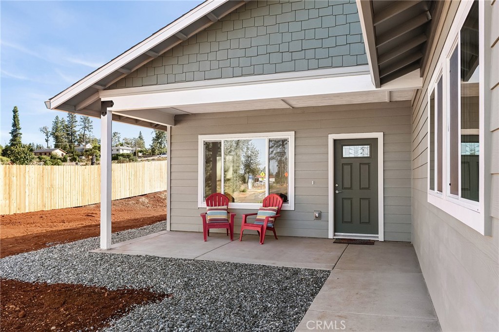 6078 Maxwell Drive Paradise, CA 95969 - Photo 5 of 44 a backyard of a house with wooden floor and outdoor seating