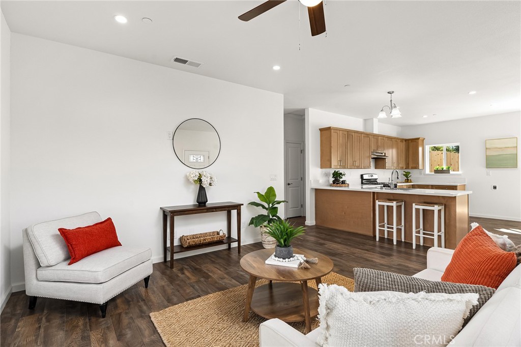 6078 Maxwell Drive Paradise, CA 95969 - Photo 10 of 44 a living room with furniture kitchen view and a chandelier