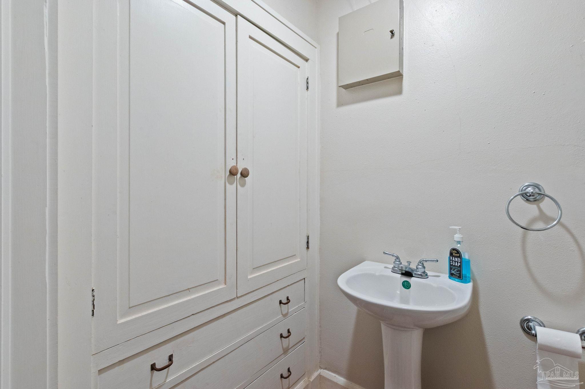 1701 Sowell Road Brewton, AL 36426 - Photo 47 of 72 a bathroom with a sink a toilet and mirror