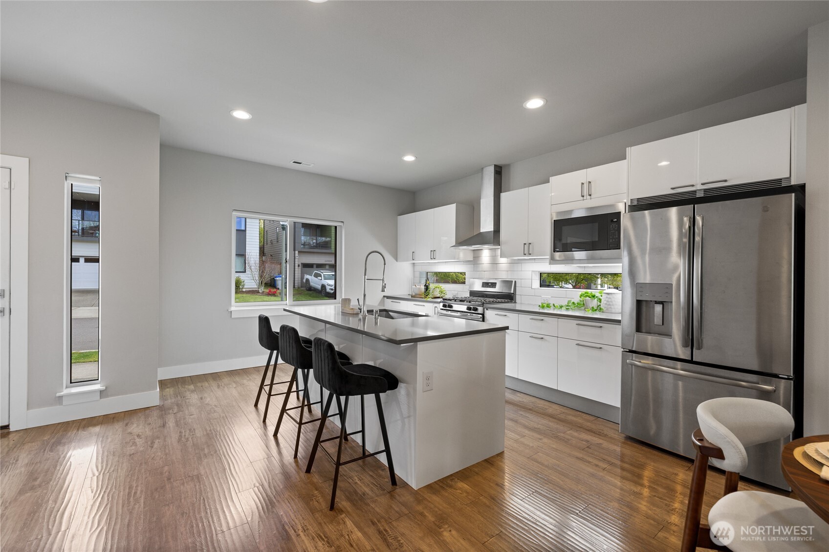24903 123rd Place Southeast Kent, WA 98030 - Photo 2 of 40 a kitchen with refrigerator and wooden floor