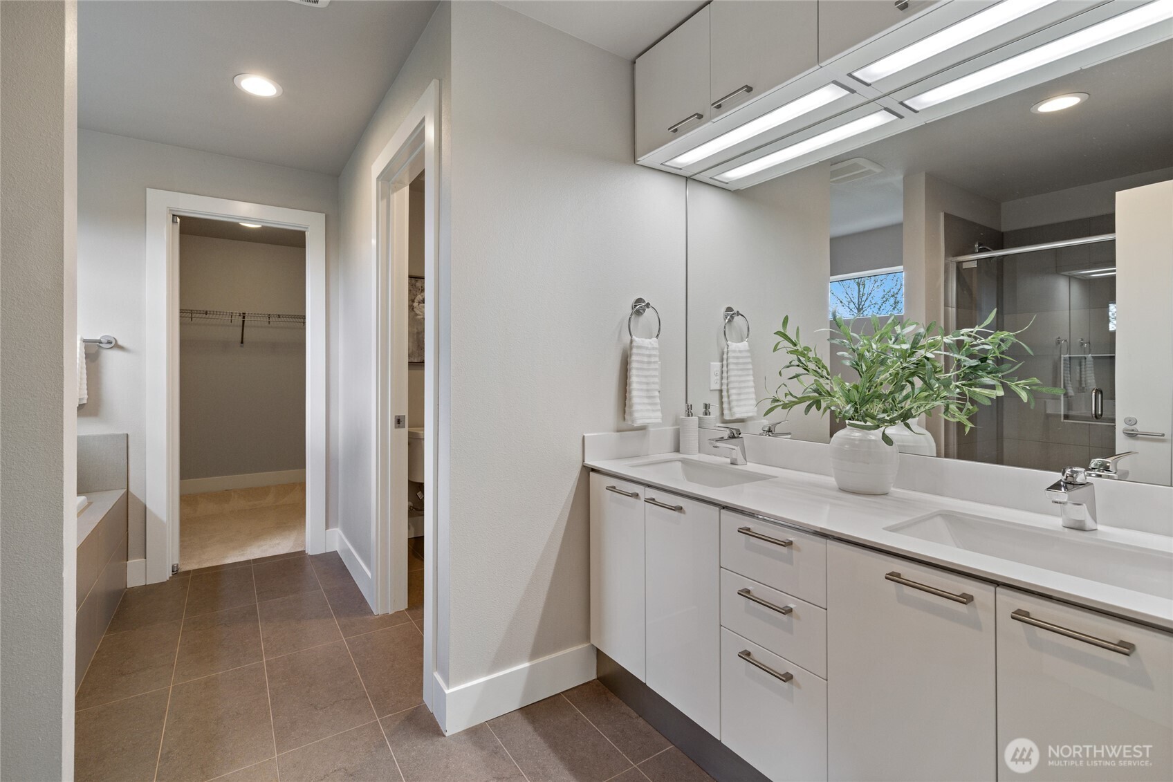 24903 123rd Place Southeast Kent, WA 98030 - Photo 24 of 40 a bathroom with a double vanity sink and a mirror