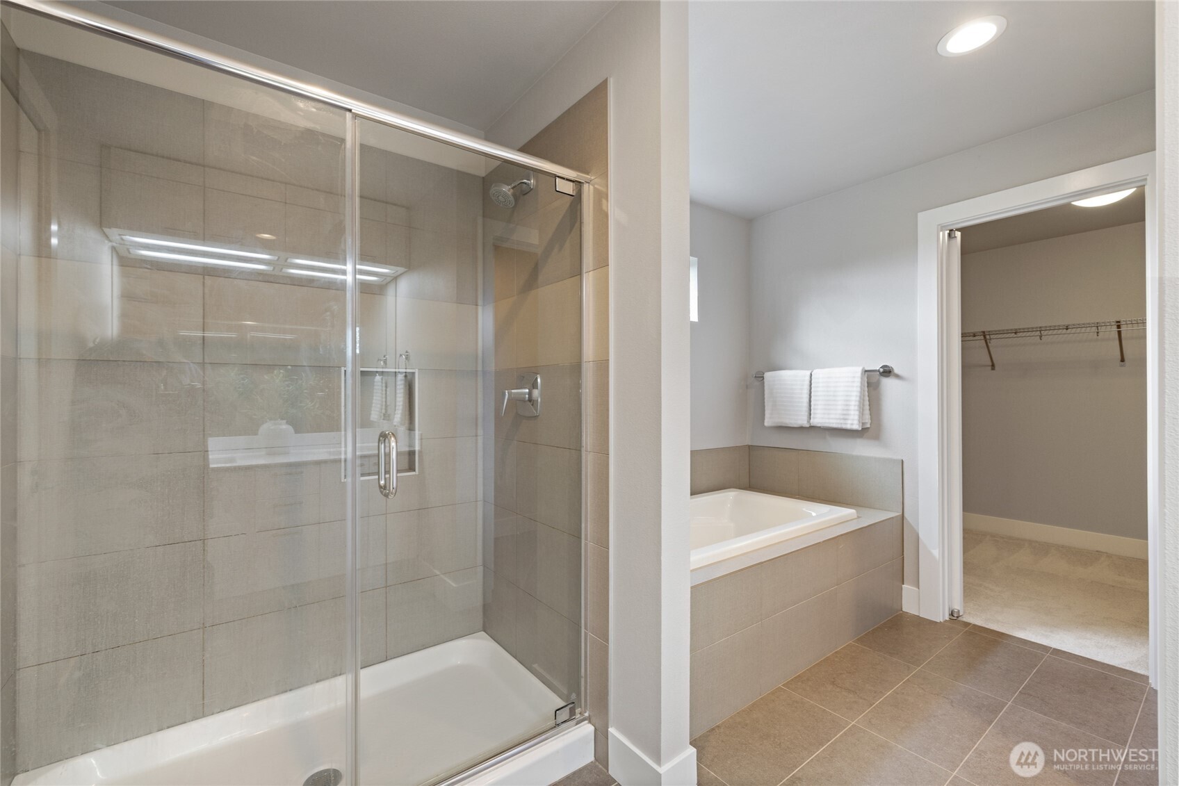 24903 123rd Place Southeast Kent, WA 98030 - Photo 25 of 40 a bathroom with a tub a sink and a shower