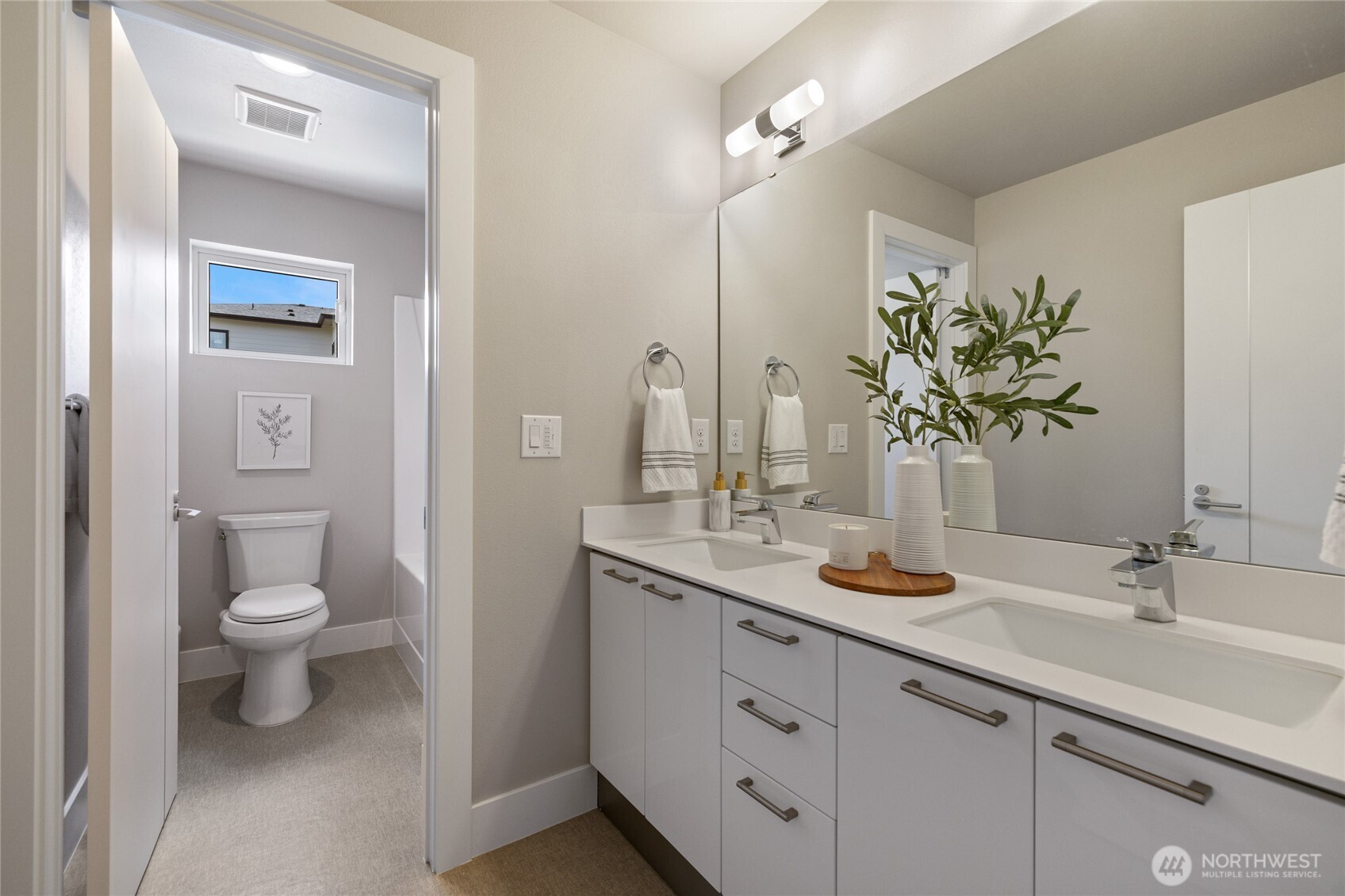 24903 123rd Place Southeast Kent, WA 98030 - Photo 31 of 40 a bathroom with a toilet sink and mirror