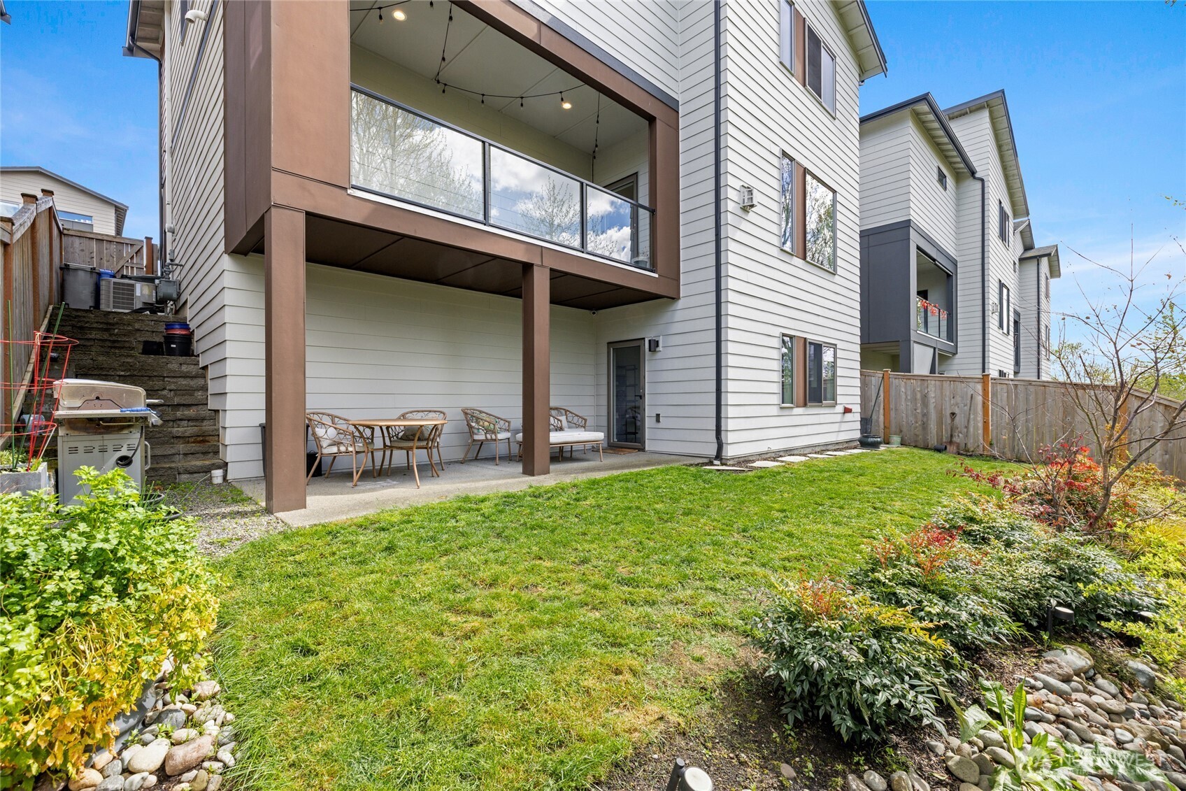 24903 123rd Place Southeast Kent, WA 98030 - Photo 37 of 40 a view of a house with a yard and sitting area
