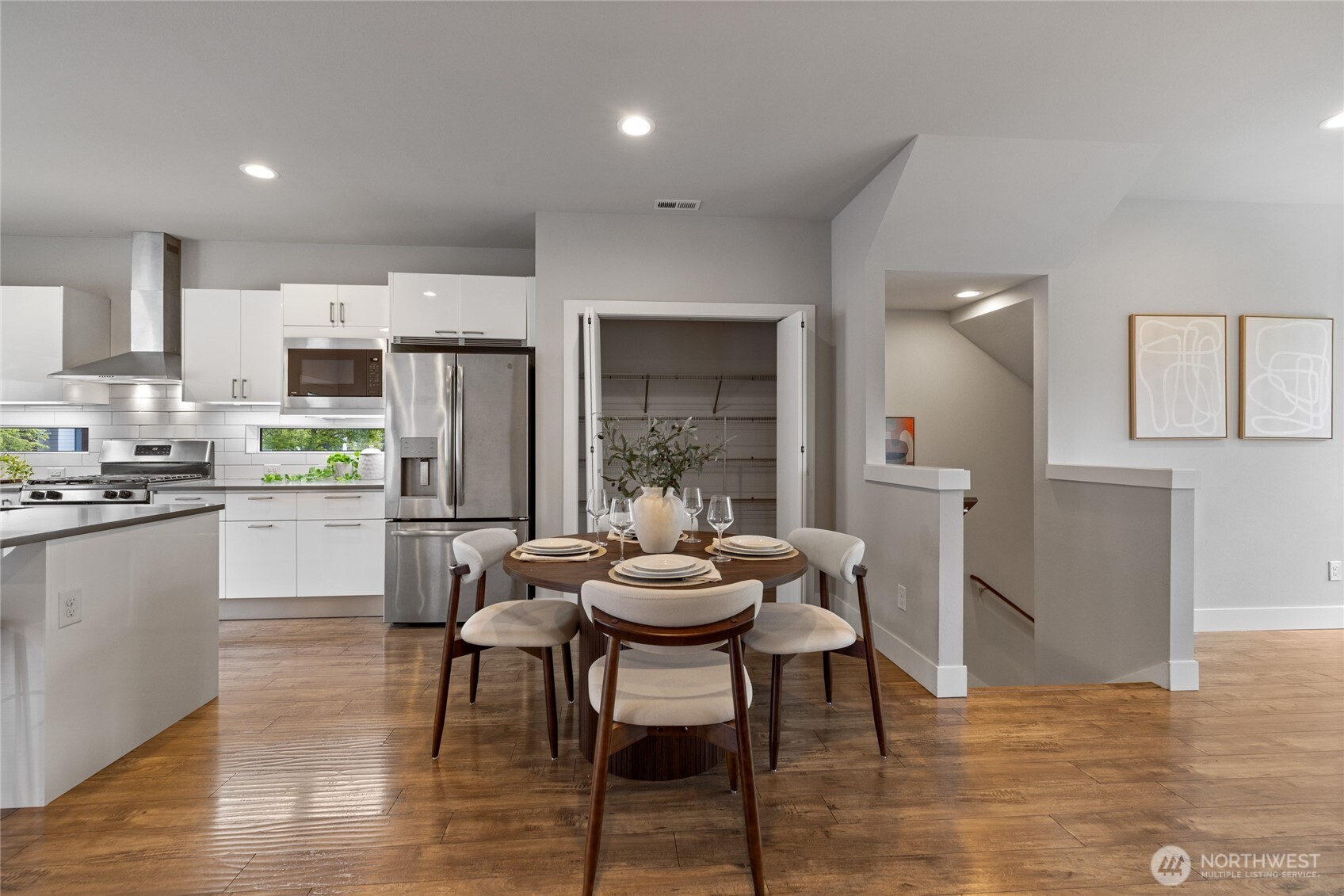 24903 123rd Place Southeast Kent, WA 98030 - Photo 8 of 40 a kitchen with a dining table chairs and refrigerator