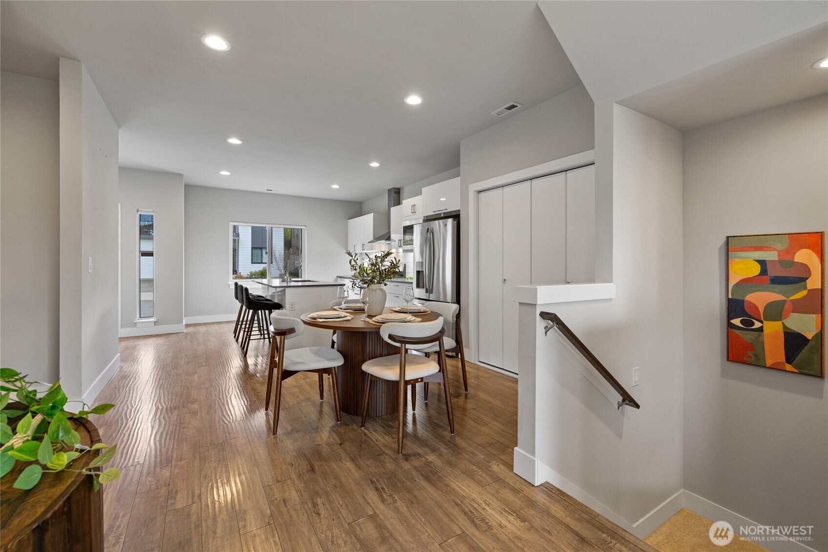 24903 123rd Place Southeast Kent, WA 98030 - Photo 10 of 40 a view of a dining room with furniture and wooden floor