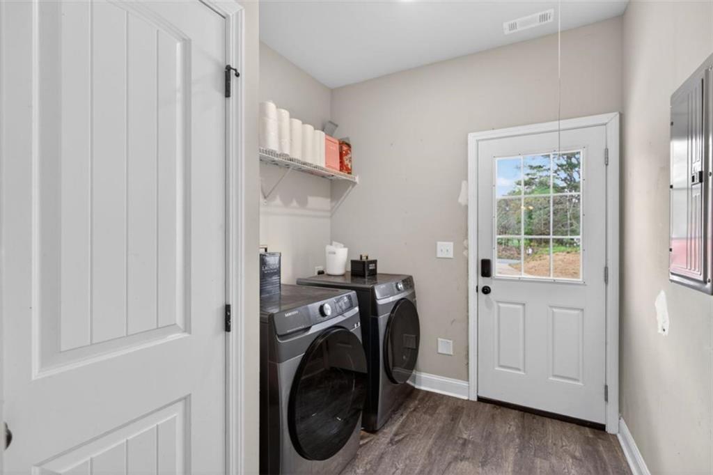 184 King Farm Road Rockmart, GA 30153 - Photo 11 of 25 a view of a hallway with washer and dryer
