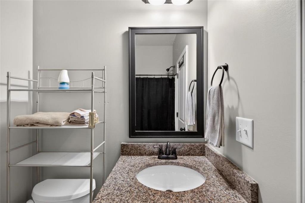 184 King Farm Road Rockmart, GA 30153 - Photo 20 of 25 a bathroom with a toilet sink and mirror