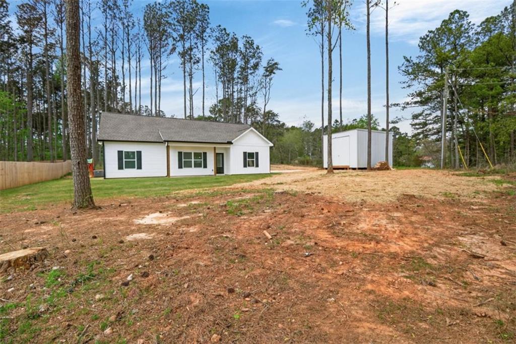184 King Farm Road Rockmart, GA 30153 - Photo 2 of 25 a front view of a house with a yard and trees